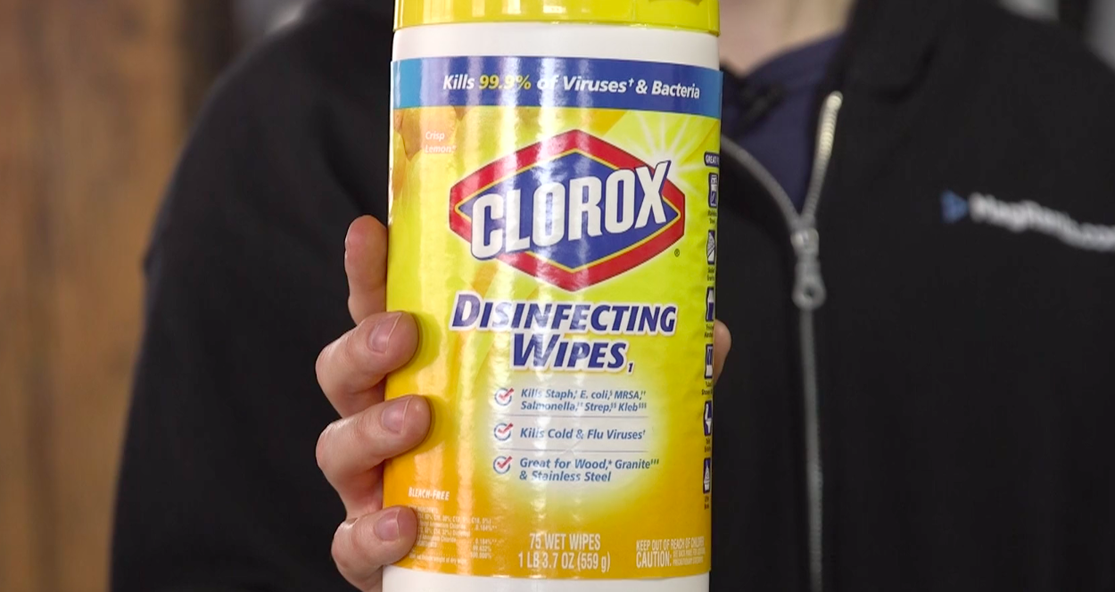 We are disinfecting our equipment with disinfectant wipes.